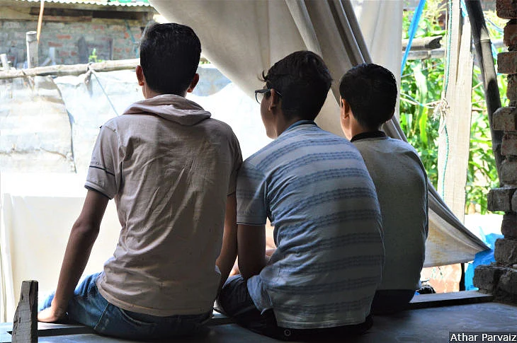 Children from Rainawari in downtown Srinagar sitting in a courtyard. They have not gone to school since 4 August, 2019, though the government<a href="https://www.indiatoday.in/india/story/jammu-and-kashmir-news-live-updates-article-370-1582143-2019-08-19"> said</a> on 19 August that schools had been reopened.