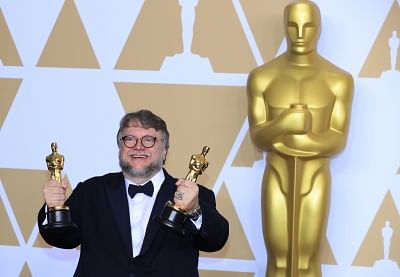LOS ANGELES, March 5, 2018 (Xinhua) -- Director Guillermo del Toro poses after winning the Best Director award and the Best Picture award for "The Shape of Water" at press room of the 90th Academy Awards at the Dolby Theater in Los Angeles, the United States, on March 4, 2018. (Xinhua/Li Ying/IANS)