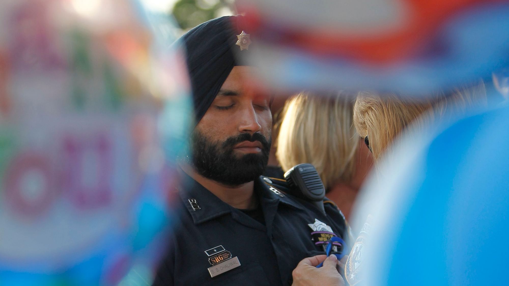 Slain Texas cop Sandeep Dhaliwal carried a badge and a gun while devoting his life to a faith that teaches love and peace.