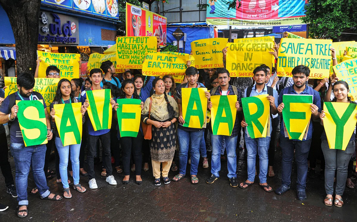 Students display placards during an awareness programme for conservation of trees, in Mumbai. 