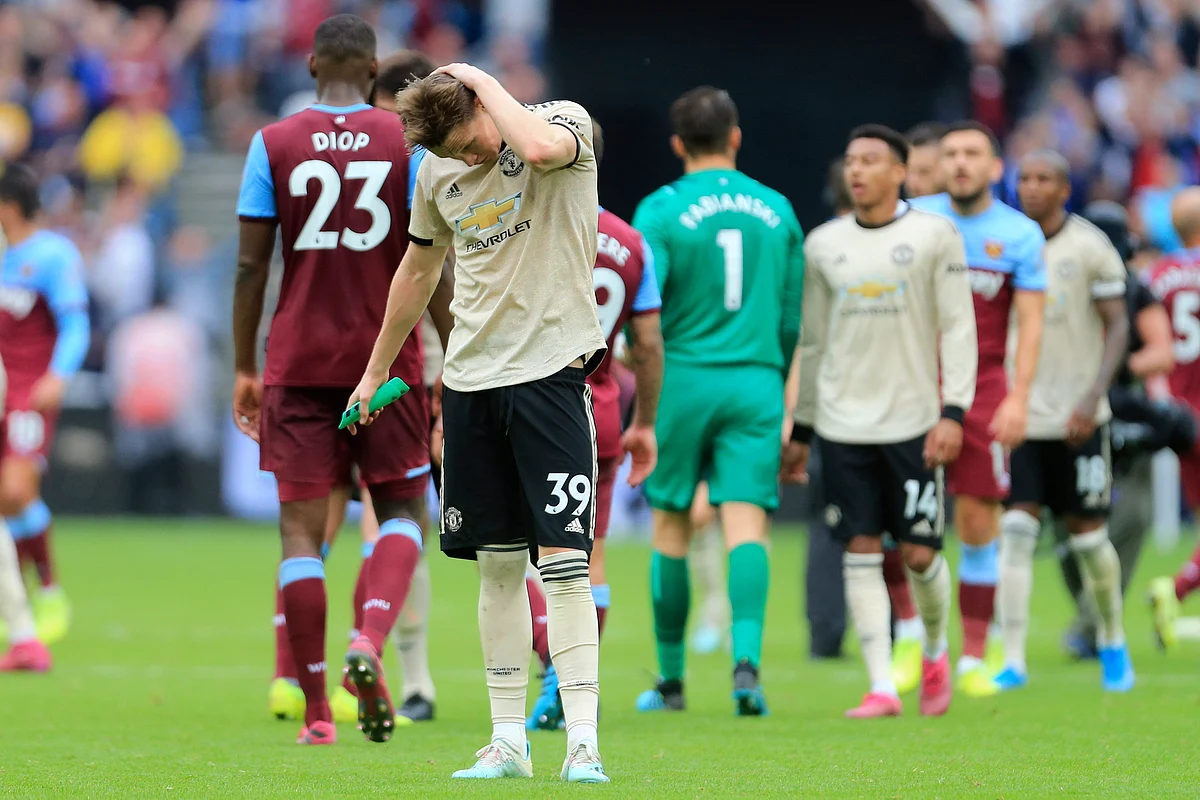 Manchester United’s Scott McTominay salutes supporters at at the end of the English Premier League soccer match between West Ham and Manchester United at London stadium in London.