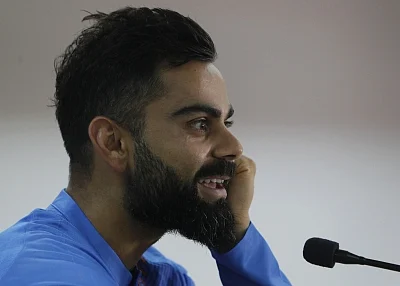 Dharamsala: Indian skipper Virat Kohli addresses a press conference on the eve of their first T20I match against South Africa, at Himachal Pradesh Cricket Association Stadium in Dharamsala on Sep 14, 2019. (Photo: Surjeet Yadav/IANS)