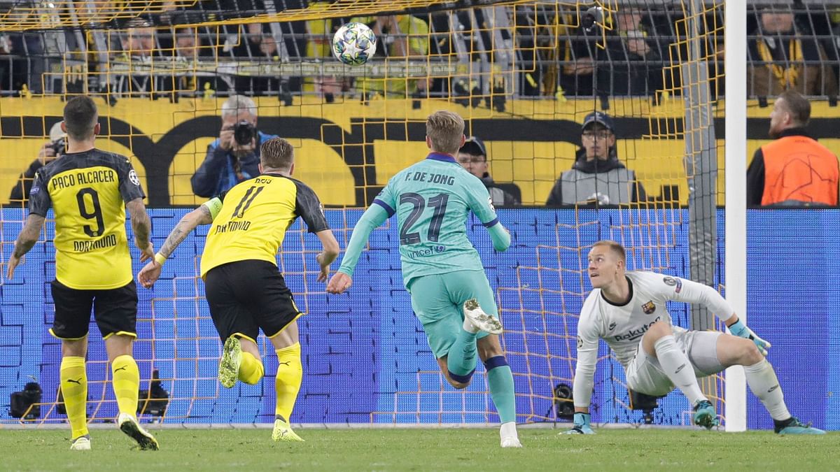 Barcelona goalkeeper Marc-Andre ter Stegen avoided a defeat by saving a penalty from Dortmund captain Marco Reus.