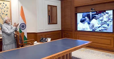 New Delhi: Prime Minister Narendra Modi witnesses the launch of Geosynchronous Satellite Launch Vehicle-Mark III (GSLV-Mk III), carrying the 3,850 kg Chandrayaan-2 spacecraft that blasted off from the Sriharikota spaceport in Andhra Pradesh; in New Delhi on July 22, 2019. (Photo: IANS/PIB)