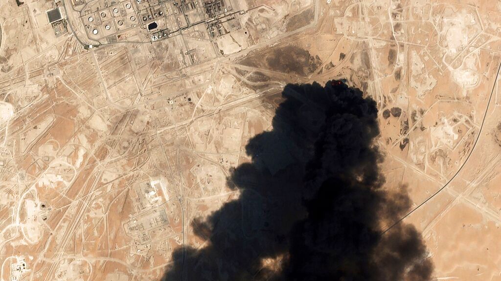 In this Saturday, 14 September, 2019 file photo, a satellite image from Planet Labs Inc. shows thick black smoke rising from Saudi Aramco’s Abqaiq oil processing facility in Buqyaq, Saudi Arabia.