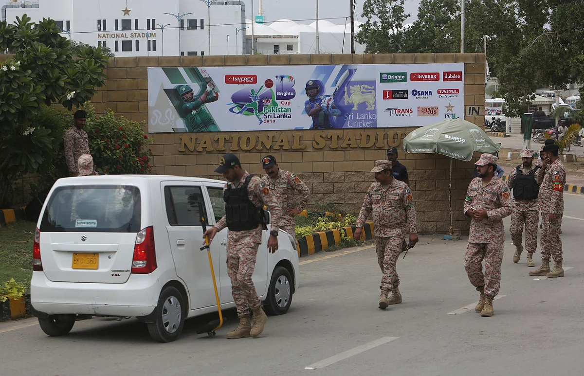 Pakistani security official check a car outside the National Stadium, a venue for the upcoming Pakistan-Sri Lanka cricket series, Wednesday, Sept. 25, 2019 in Karachi, Pakistan. 