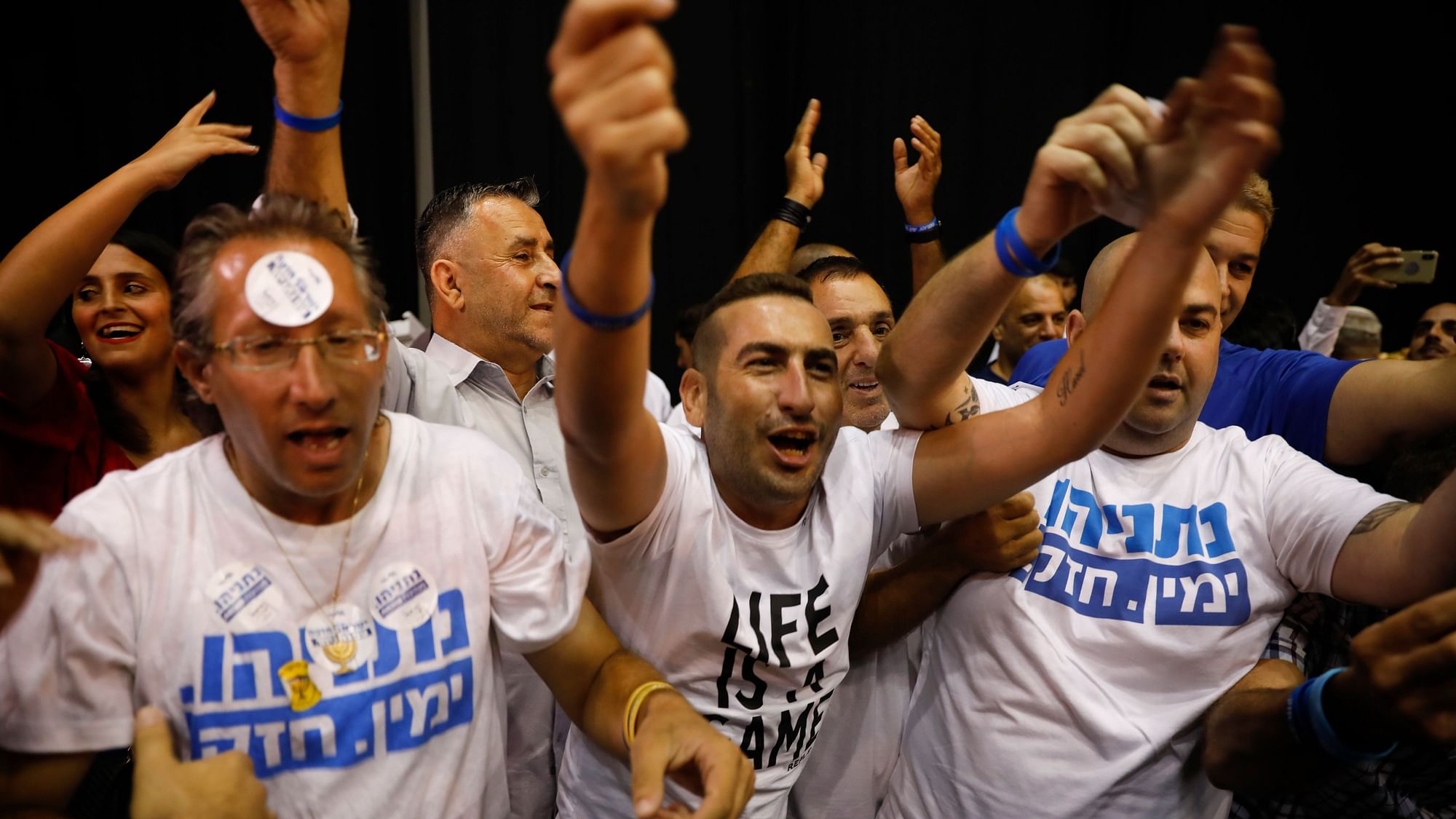 Israeli Prime Minister Benjamin Netanyahu supporters chant as they await results of the elections in Tel Aviv.