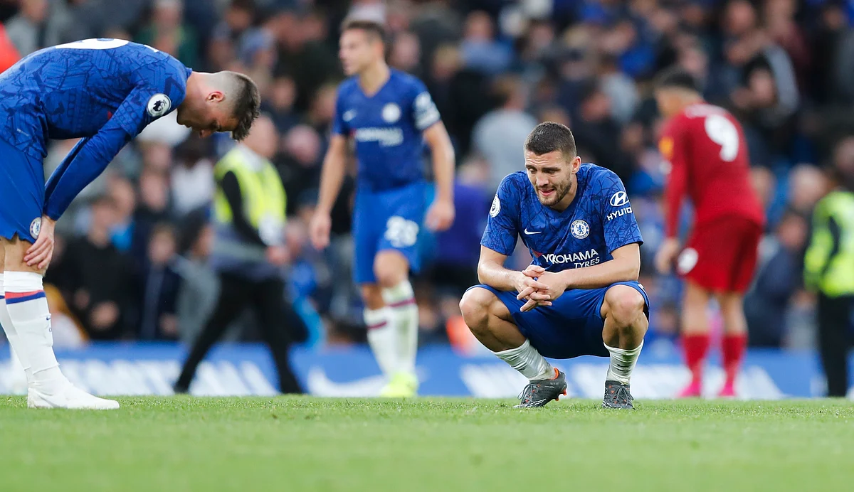 Chelsea’s Mateo Kovacic, right, and Mason Mount react at the end of the British Premier League soccer match between Chelsea and Liverpool, at the Stamford Bridge Stadium, London.