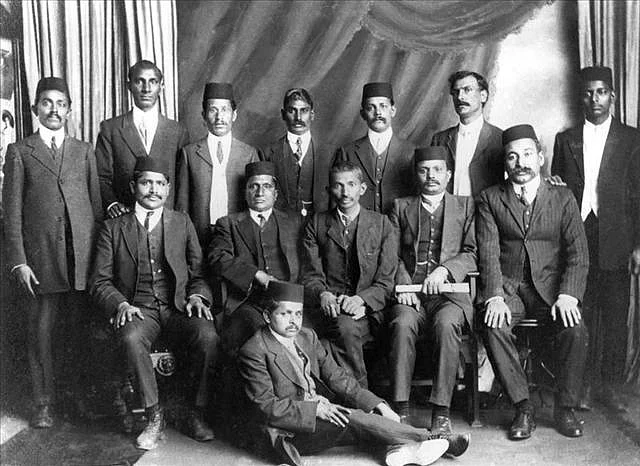 MK Gandhi (seated, centre) and other members of the Indian community fighting against the discrimination laws at the Empire Theater in Johannesburg.