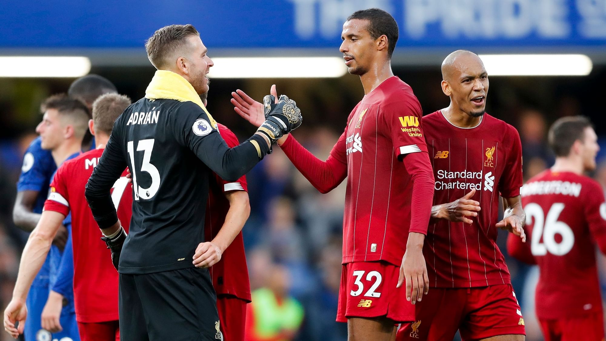 Liverpool goalkeeper Adrian, left, and Joel Matip celebrate their side’s 2-1 win at the end of the British Premier League soccer match between Chelsea and Liverpool, at the Stamford Bridge Stadium.