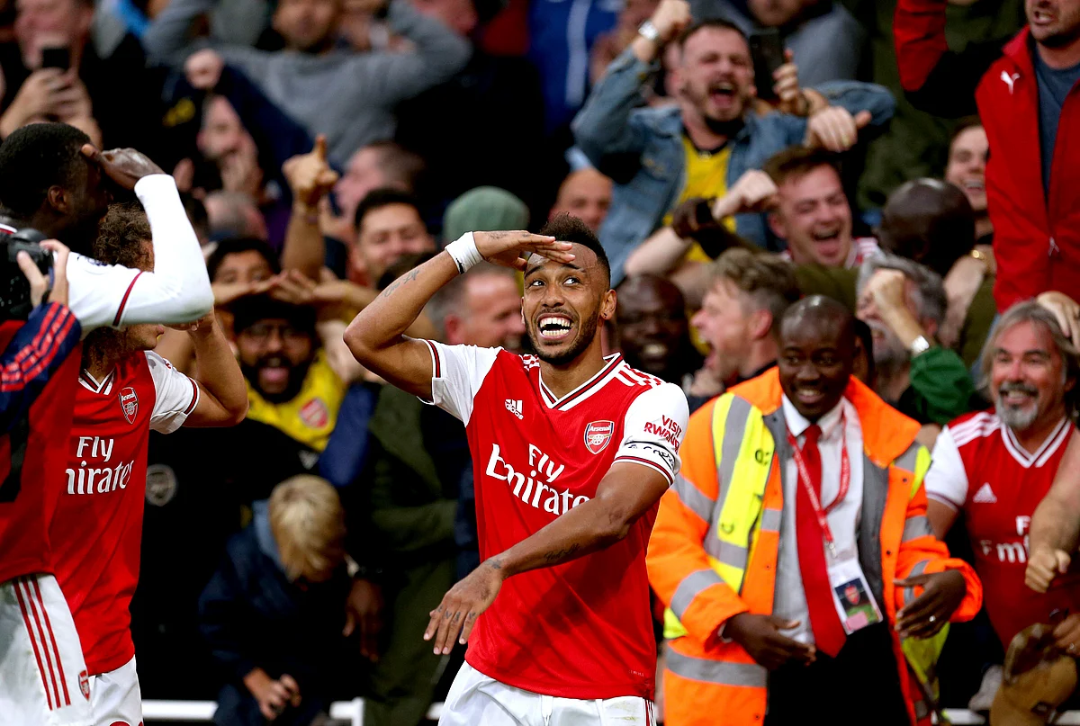 Arsenal’s Pierre-Emerick Aubameyang (centre) celebrates scoring his side’s third goal of the game during the Premier League match at the Emirates Stadium, London. PA Photo.