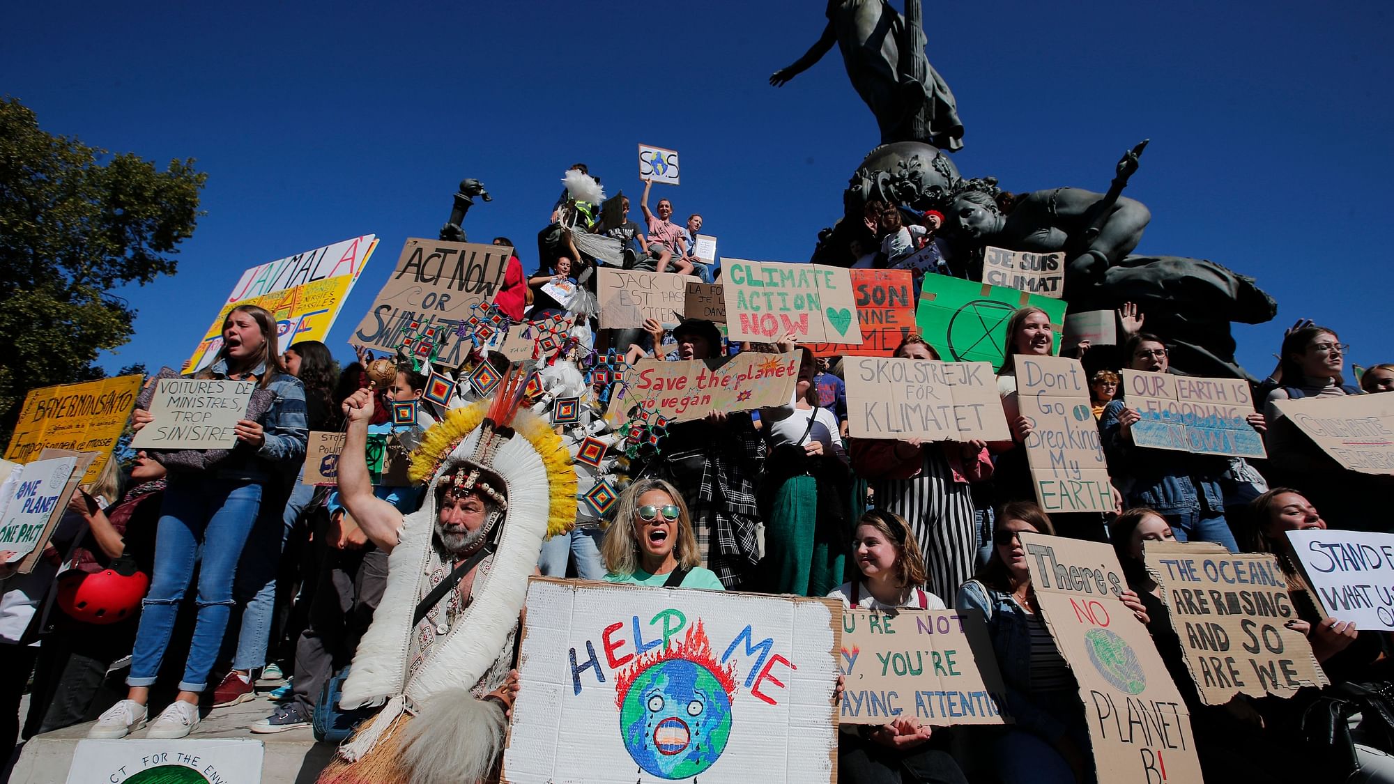 Youths gather at Nation square at the start of a climate demonstration on Friday, 20 September in Paris.