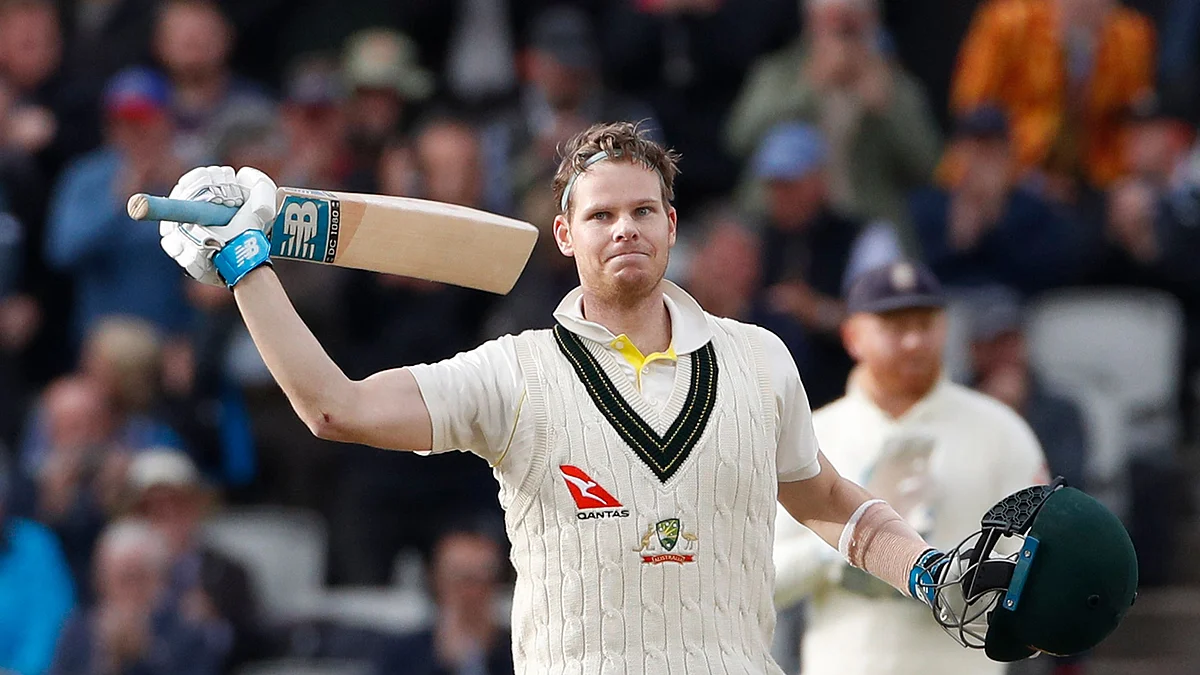 Australia’s Steve Smith raises his bat after scoring 200 runs during day two of the fourth Ashes Test cricket match between England and Australia at Old Trafford in Manchester, England, Thursday, Sept. 5, 2019. 