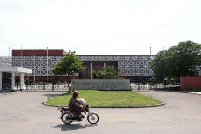 ISLAMABAD, May 25, 2019 (Xinhua) -- A motorcyclist drives past the building of Pakistan-China Friendship center in Islamabad, capital of Pakistan, on May 22, 2019. China and Pakistan will join hands in building a closer community of shared future in the new era against the backdrop of changing international landscapes, Chinese Ambassador Yao Jing said. The China-Pakistan Economic Corridor (CPEC), a major pilot project of the China-proposed Silk Road Economic Belt and the 21st Century Maritime Si