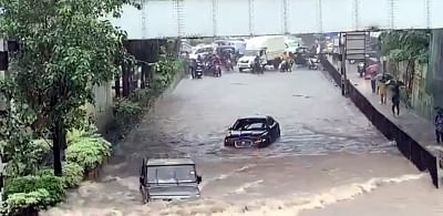 Amid heavy rain that has disrupted normal life here, with people posting pictures and videos on the citys flooded roads, a video has gone viral showing a Jaguar is stranded in a flooded underpass at Airoli in Navi Mumbai, but an Indian-made SUV Bolero zips past despite the flooding and gets to the other side of the road without any incident.