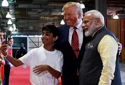 Huston: Prime Minister Narendra Modi and US President Donald Trump pose for a selfie with a kid in Huston on Sep 22, 2019.