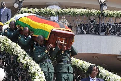 HARARE, Sept. 13, 2019 (Xinhua) -- The casket of the late former Zimbabwean President Robert Mugabe is taken out of his residence in Harare, Zimbabwe, on Sept. 13, 2019. Thousands of Zimbabweans thronged Rufaro Stadium in Harare on Friday for the continuation of the body viewing of the late former President of Zimbabwe Robert Mugabe, who died in Singapore last week at the age of 95. (Photo by Chen Yaqin/Xinhua/IANS)