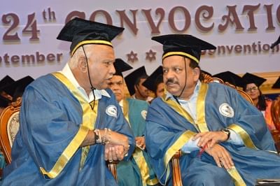 Bengaluru: Union Health and Family Welfare Minister Harsh Vardhan in a conversation with Karnataka Chief Minister B. S. Yediyurappa during the 24th Convocation ceremony of National Institute of Mental Health and Neuro Sciences (NIMHANS) at NIMHANS convention centre, in Bengaluru on Sep 16, 2019. (Photo: IANS)