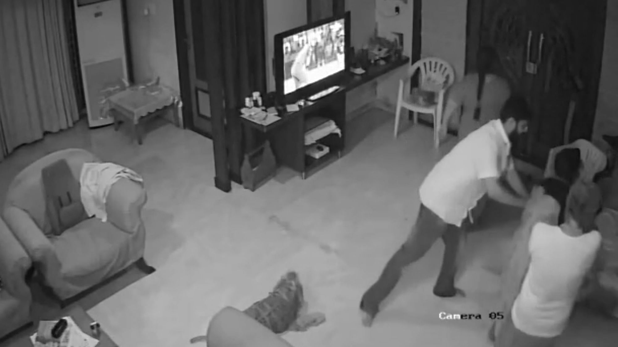 CCTV footage has been released showing a retired High Court judge, his wife and son physically abusing a woman as her two-year-old child tries hard to rescue her mother.