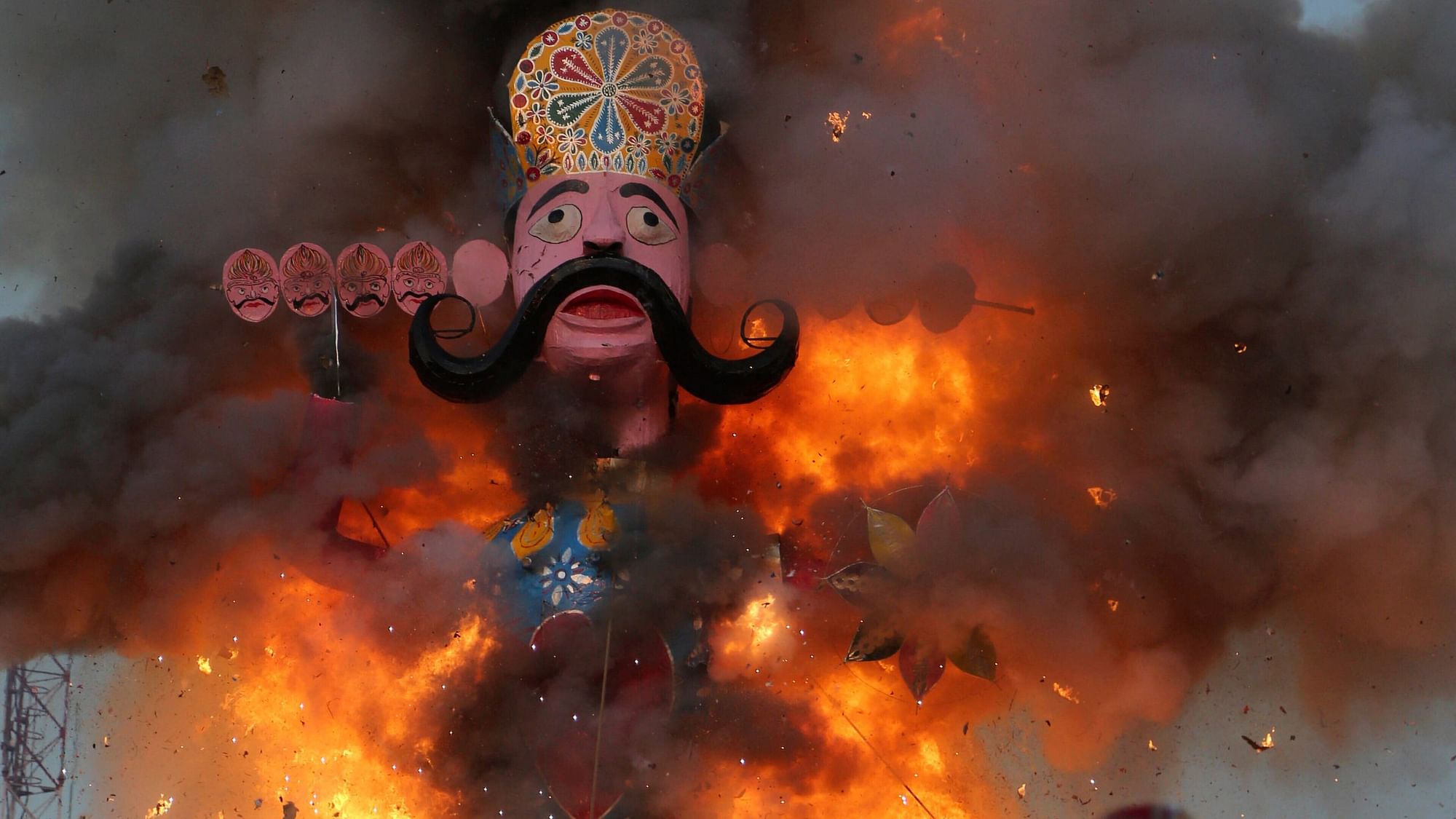 An effigy of demon king Ravana goes up in flames marking the end of Dussehra festival in Jammu.