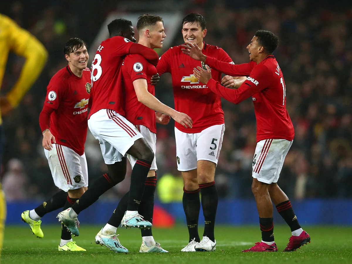 Manchester United players celebrate after Manchester United’s Scott McTominay, centre, scored his side’s opening goal.