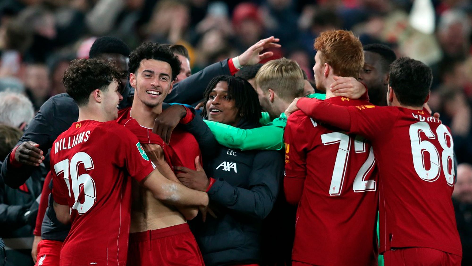 After 19 goals on a wild night at Anfield, Liverpool ousted Arsenal in the League Cup to reach the quarterfinals.
