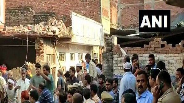 At least 10 people are feared dead and several are reported to be injured in a suspected cylinder blast at a house in Uttar Pradesh’s Mau district, that led to the collapse of a two-storey building.