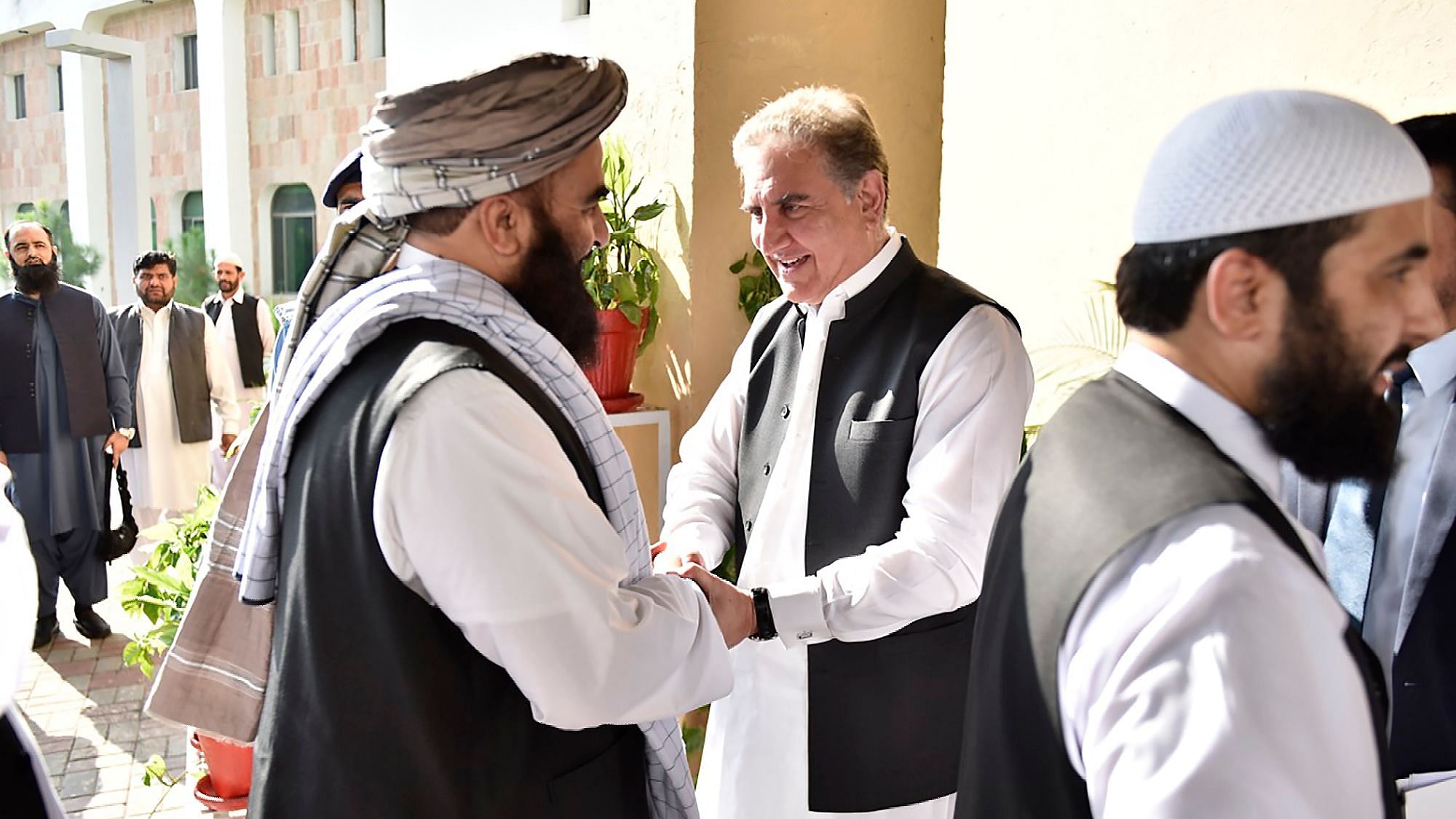 Pakistan’s Foreign Minister Shah Mehmood Qureshi, receives members of Taliban delegation at the Foreign Office in Islamabad, Pakistan.