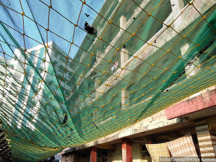 A net has been laid covering the pathway outside G block building in Worli. The net was installed to protect the people who are walking on the pathway from the debris that may fall.