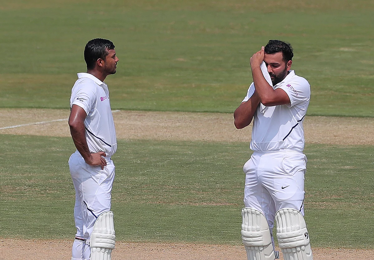 Mayank Agarwal and Rohit Sharma take a break during their 317-run stand on Day 2 of the Vizag Test.