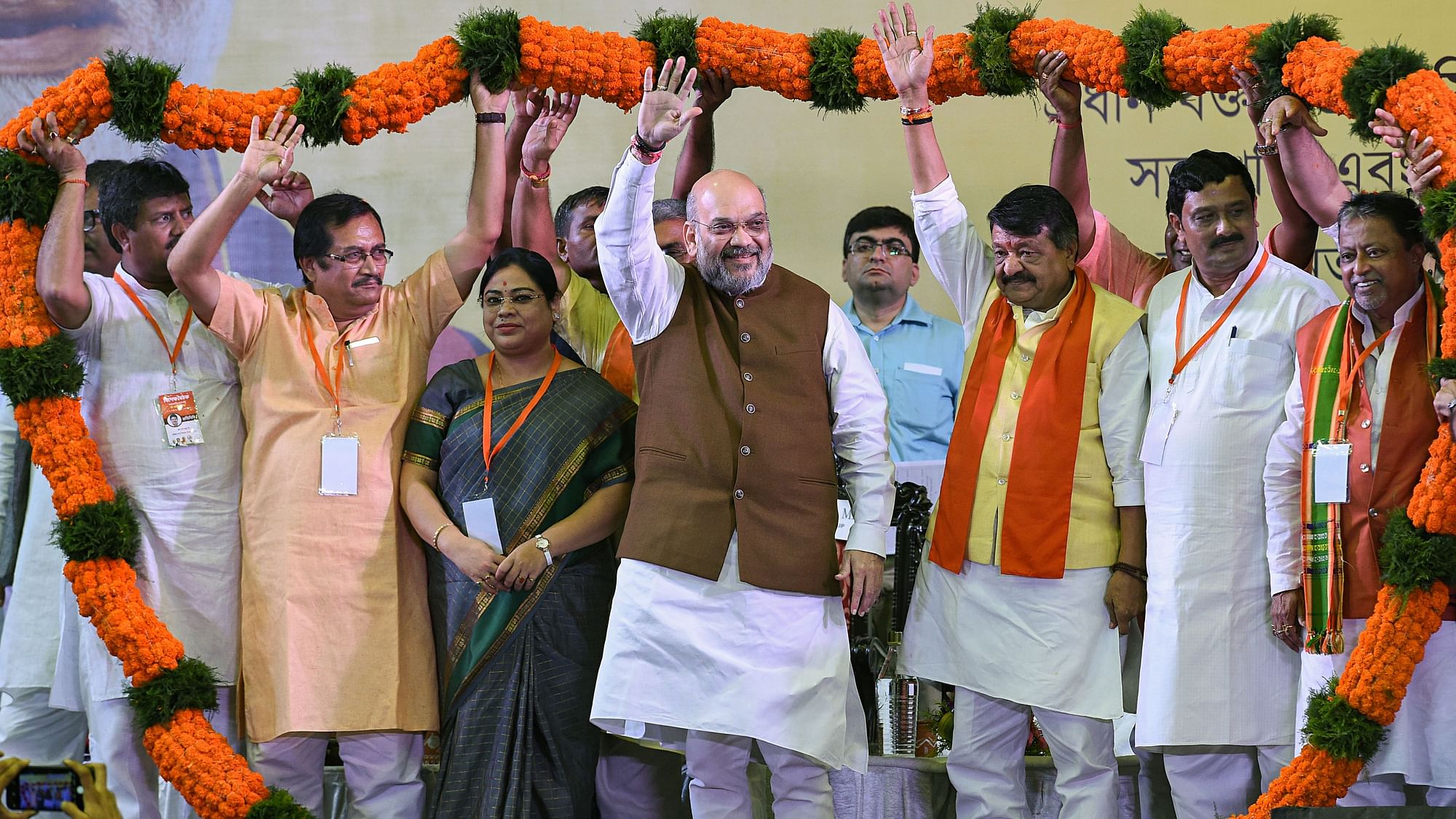 Union Home Minister Amit Shah being garlanded at a rally, in Kolkata.