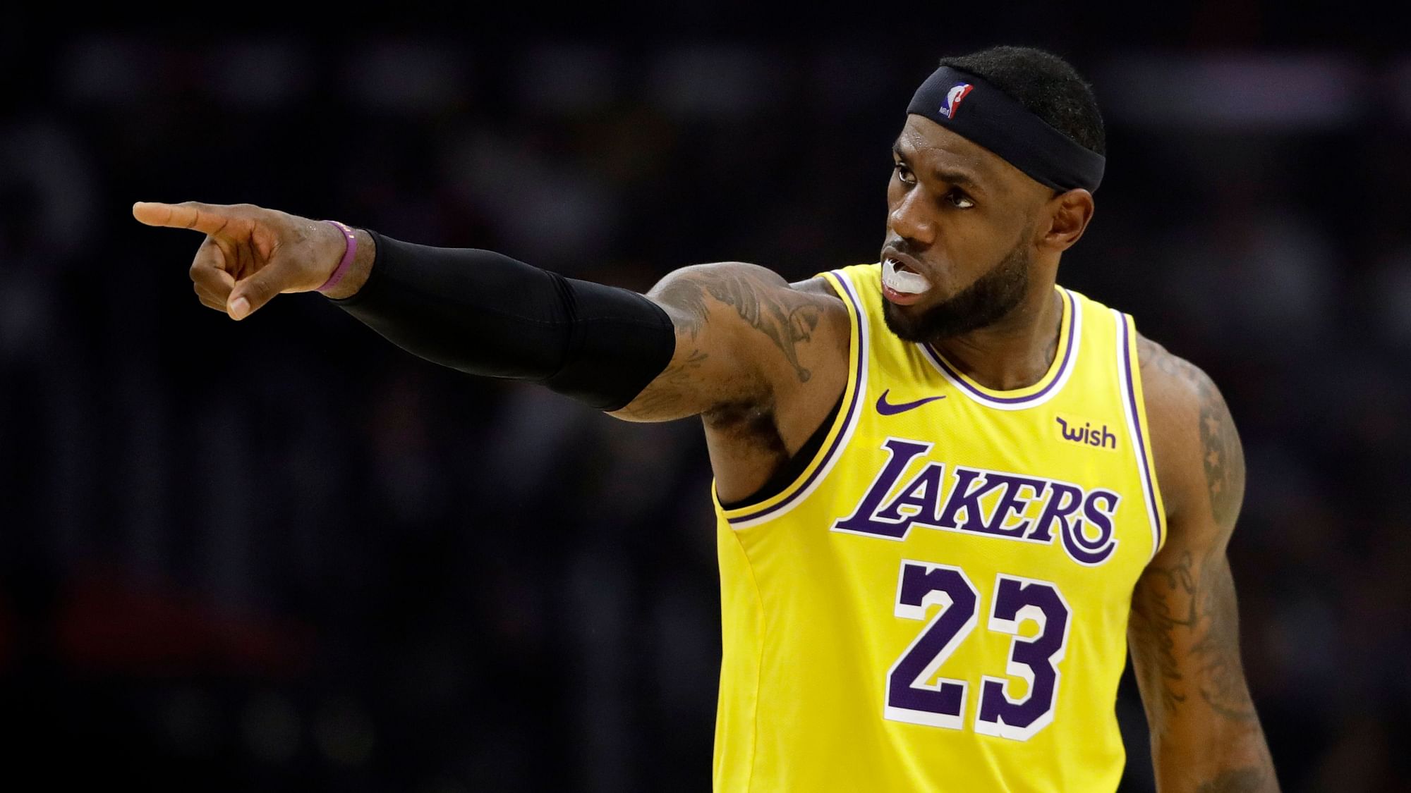 Los Angeles Lakers’ LeBron James points during the first half of the team’s NBA basketball game.&nbsp;