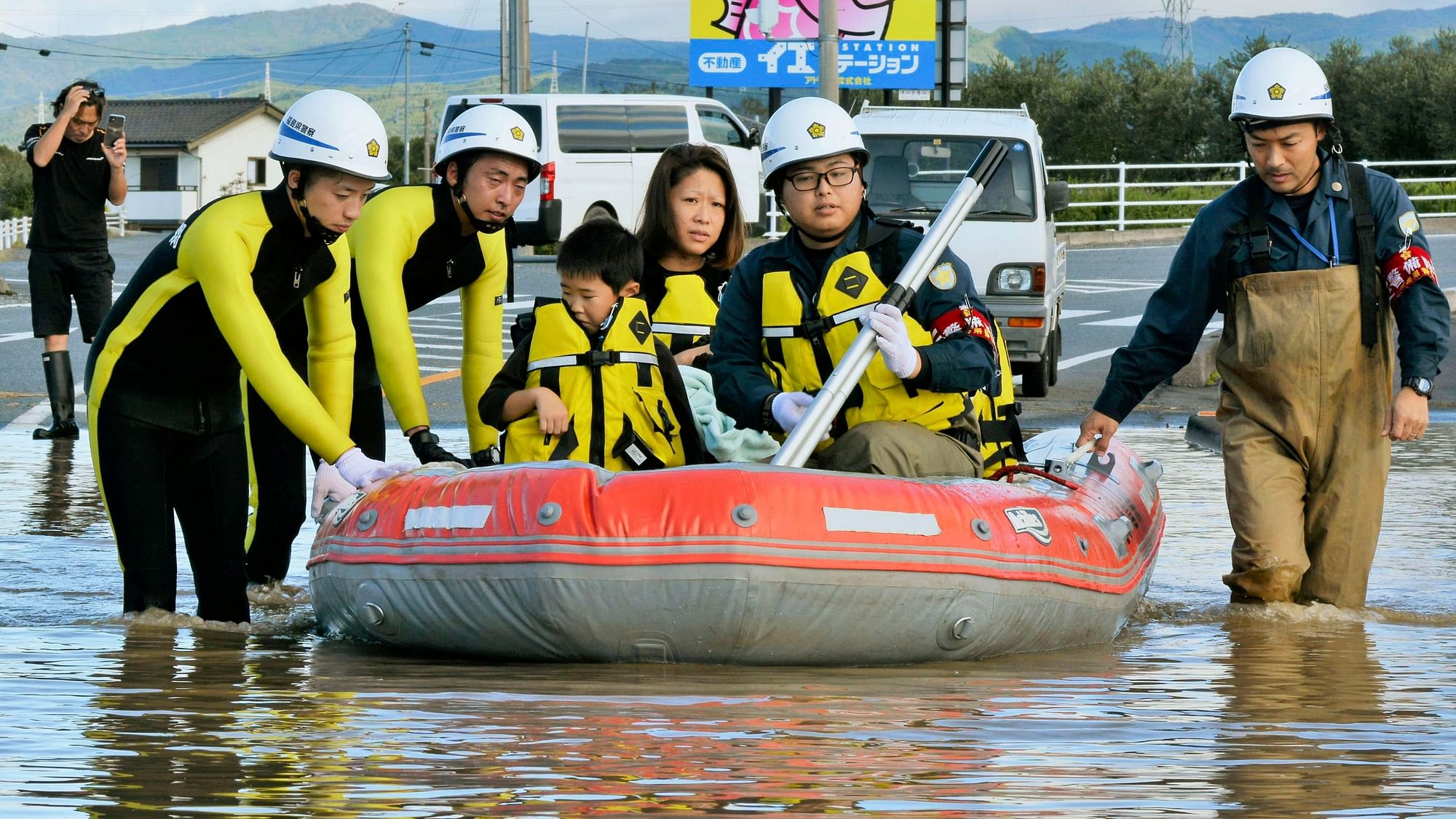 Residents on a rubber boat are rescued as they were stranded by Typhoon Hagibis, in Iwaki, Fukushima prefecture, northern Japan, Sunday, 13 Oct, 2019.