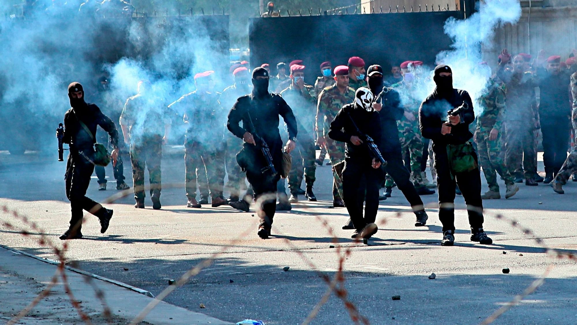 Iraqi security forces fire tear gas to disperse anti-government protesters