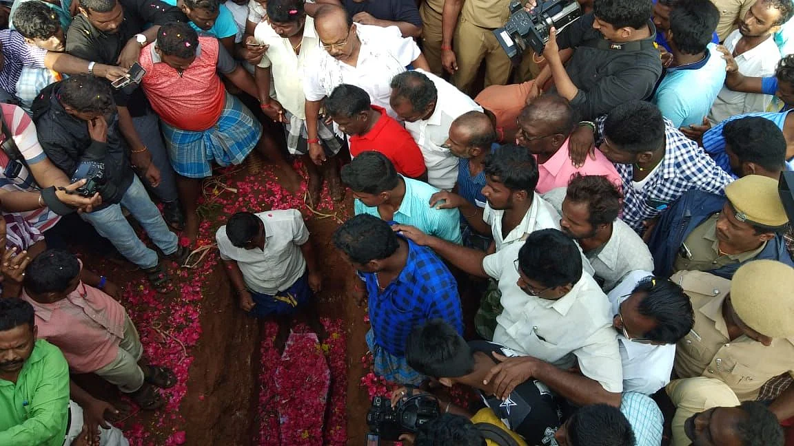 Hundreds gather for Sujith’s burial after eight hours of effort to bring him out a borewell failed.