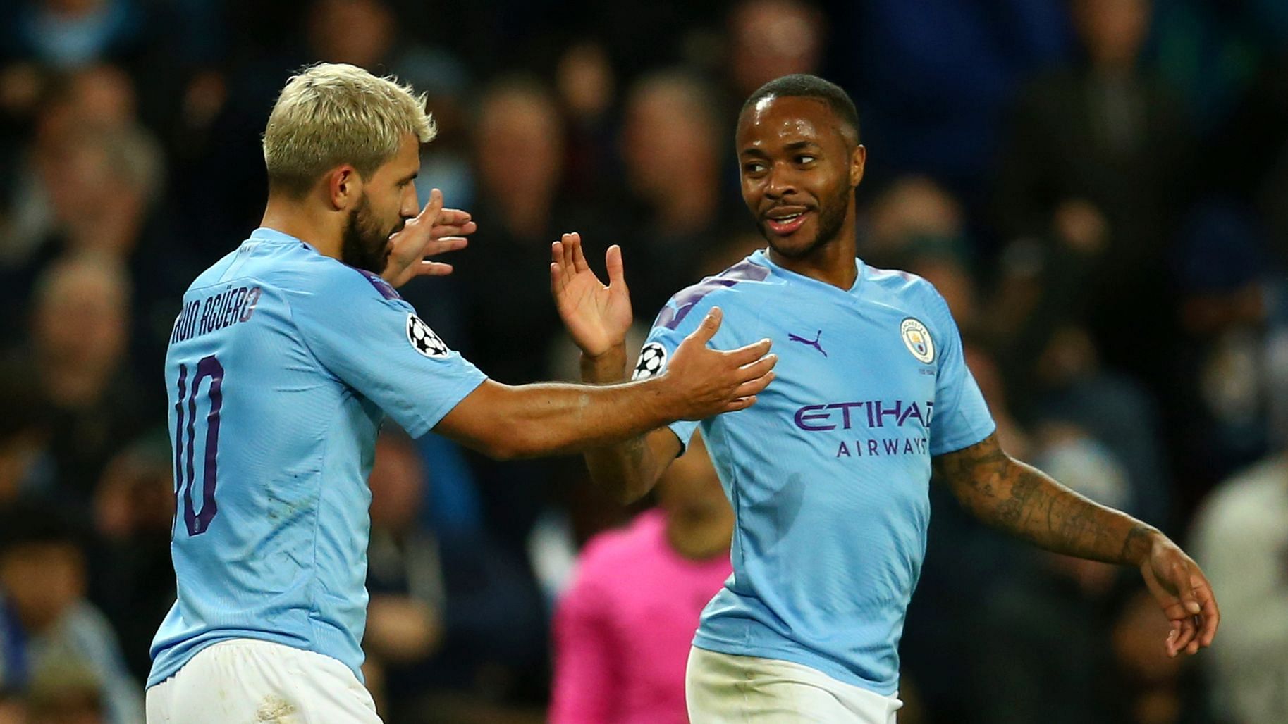 Manchester City’s Raheem Sterling, left, celebrates with his teammate Sergio Aguero after scoring his side’s fifth goal, during the group C Champions League soccer match between Manchester City and Atalanta at the Etihad Stadium in Manchester.