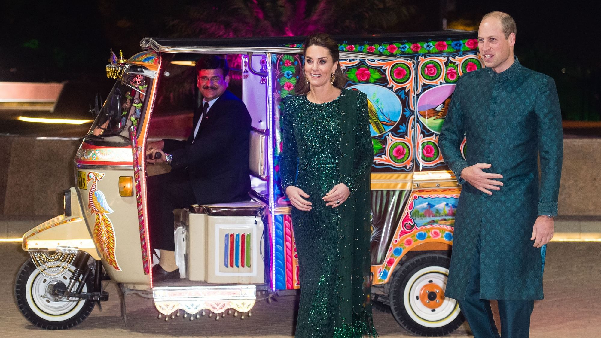 Kate Middleton and Prince William arriving in a rickshaw.