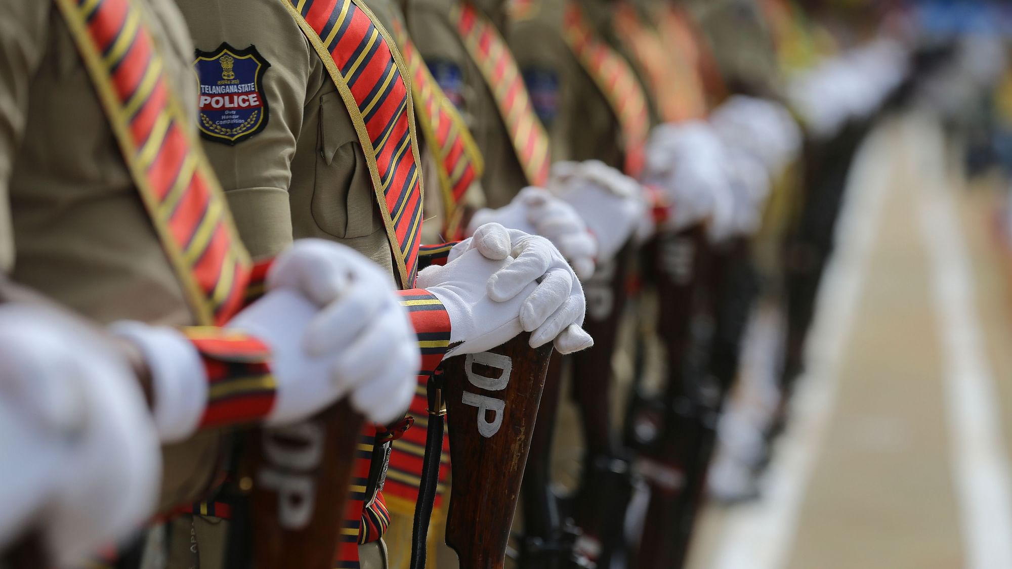 Indian policemen pay homage during a parade on Police Commemoration Day in Hyderabad, India, Monday, 21 Oct 2019.