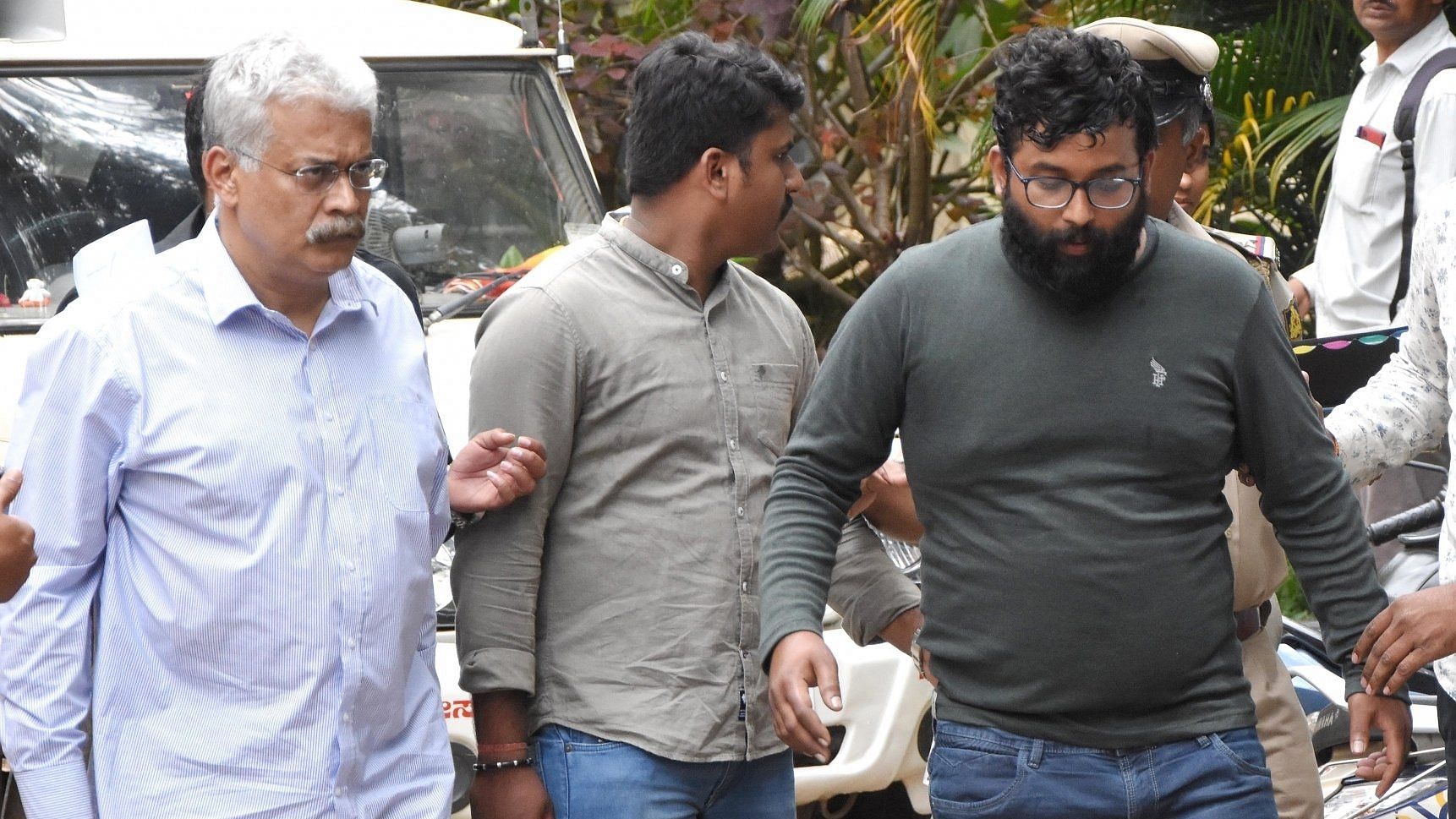 Sudhir Angur (left) Suraj Singh (in grey t shirt) being produced before the court.&nbsp;