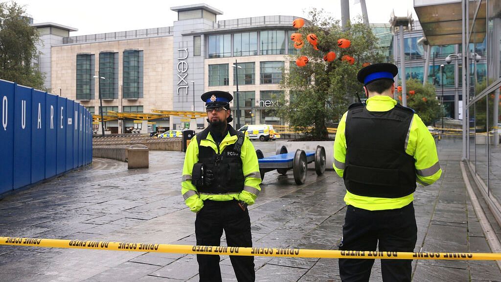 Police outside the Arndale Centre in Manchester, England, Friday 11 October, 2019, after a stabbing incident at the shopping center that left five people injured.&nbsp;