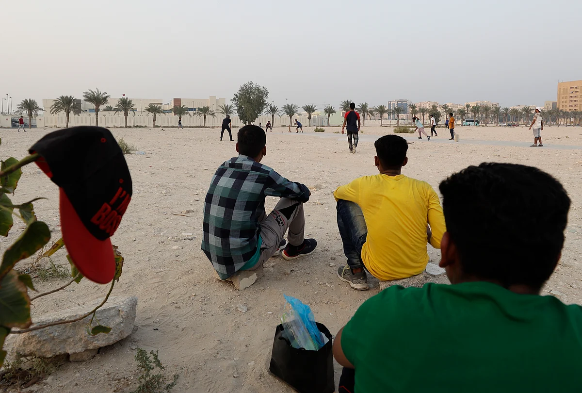 People play cricket on a patch of wasteland in Doha, Qatar, Friday, Oct. 4, 2019. The most played sport in Qatar is nowhere near the country’s glitzy, air-conditioned stadiums.
