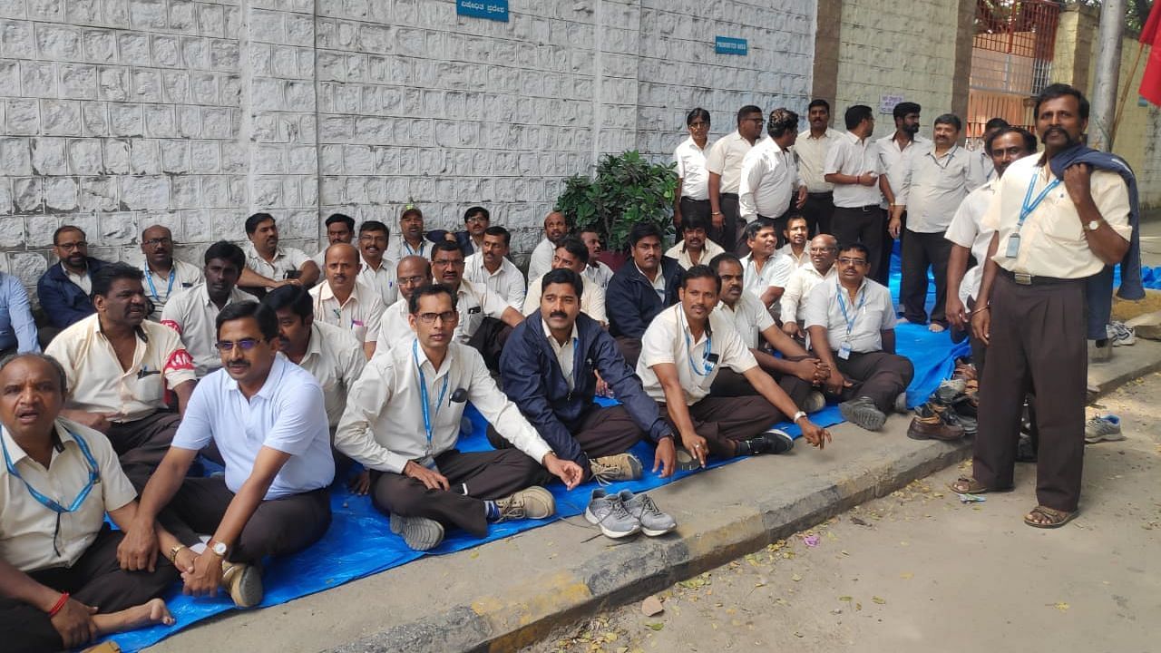 HAL workers stay away from work, protesting outside their division in Bengaluru on 14 October.