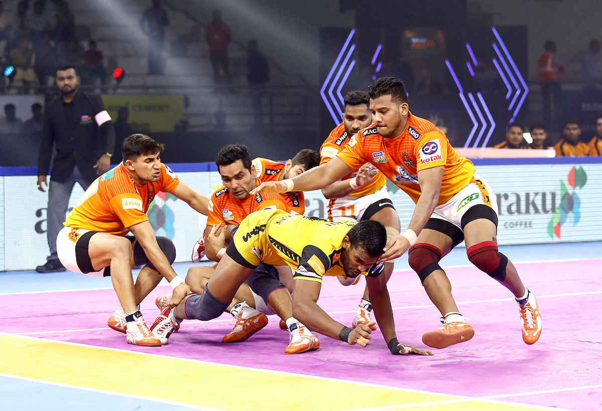 Puneri Paltan edged out Telugu Titans 53-50 in a closely-fought Pro Kabaddi League match.