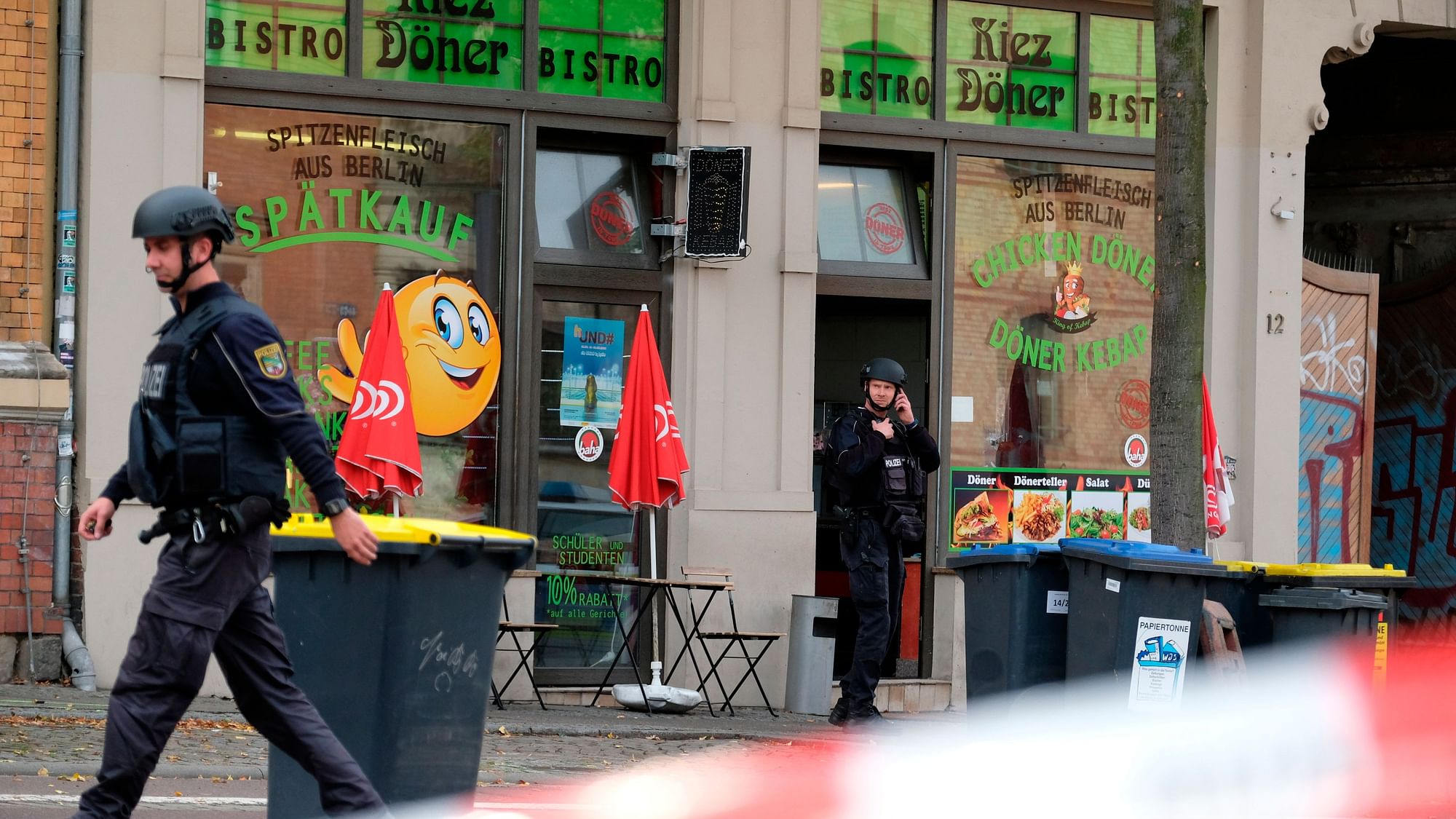 A police officer walks in front of a kebab grill in Halle, Germany, Wednesday, Oct. 9, 2019.&nbsp;