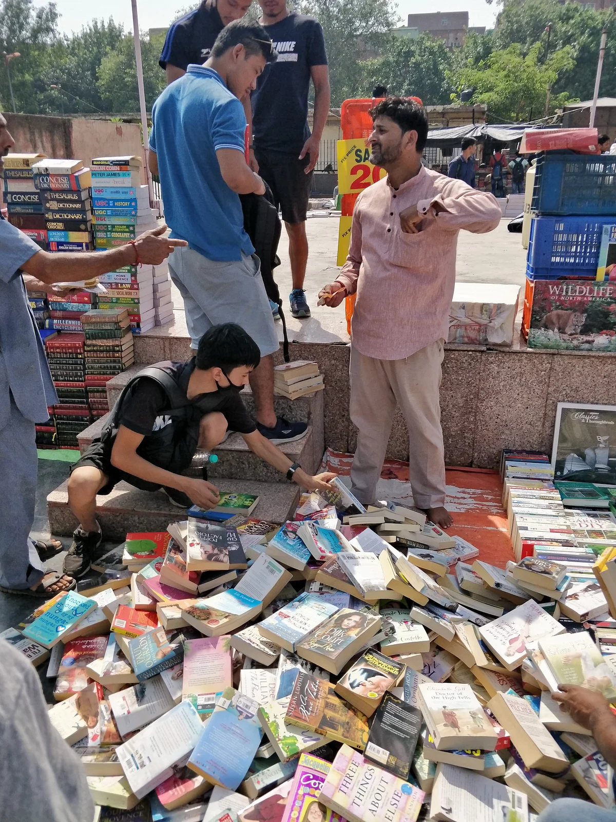 Shopkeepers had displayed all the books in the open under the scorching sun.