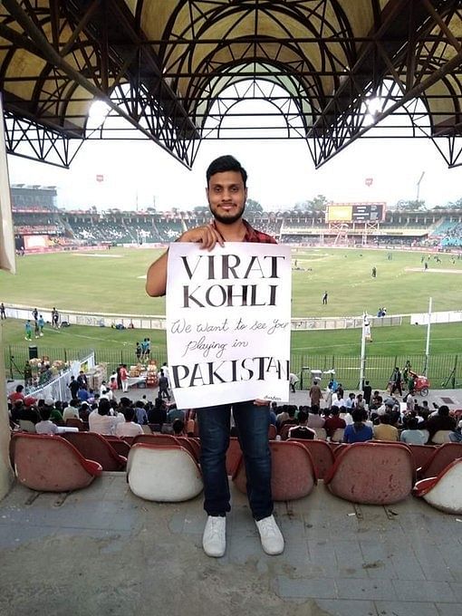 The fan at the Gadaffi Stadium held a placard reading “Virat Kohli we want to see you playing in Pakistan”.