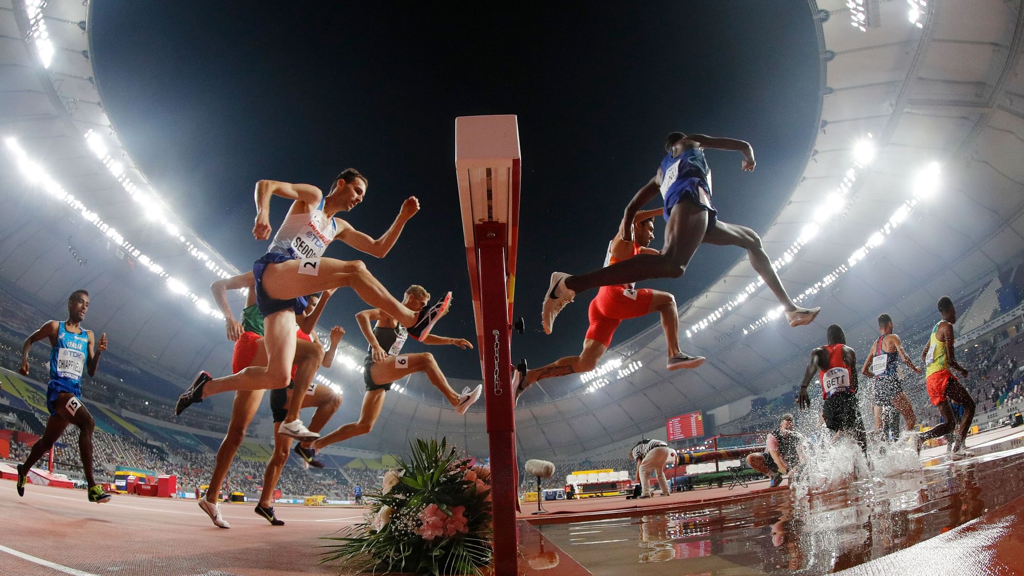 Runners compete in a men’s 3000 meter steeplechase heat at the World Athletics Championships in Doha, Qatar, Tuesday, Oct. 1, 2019.