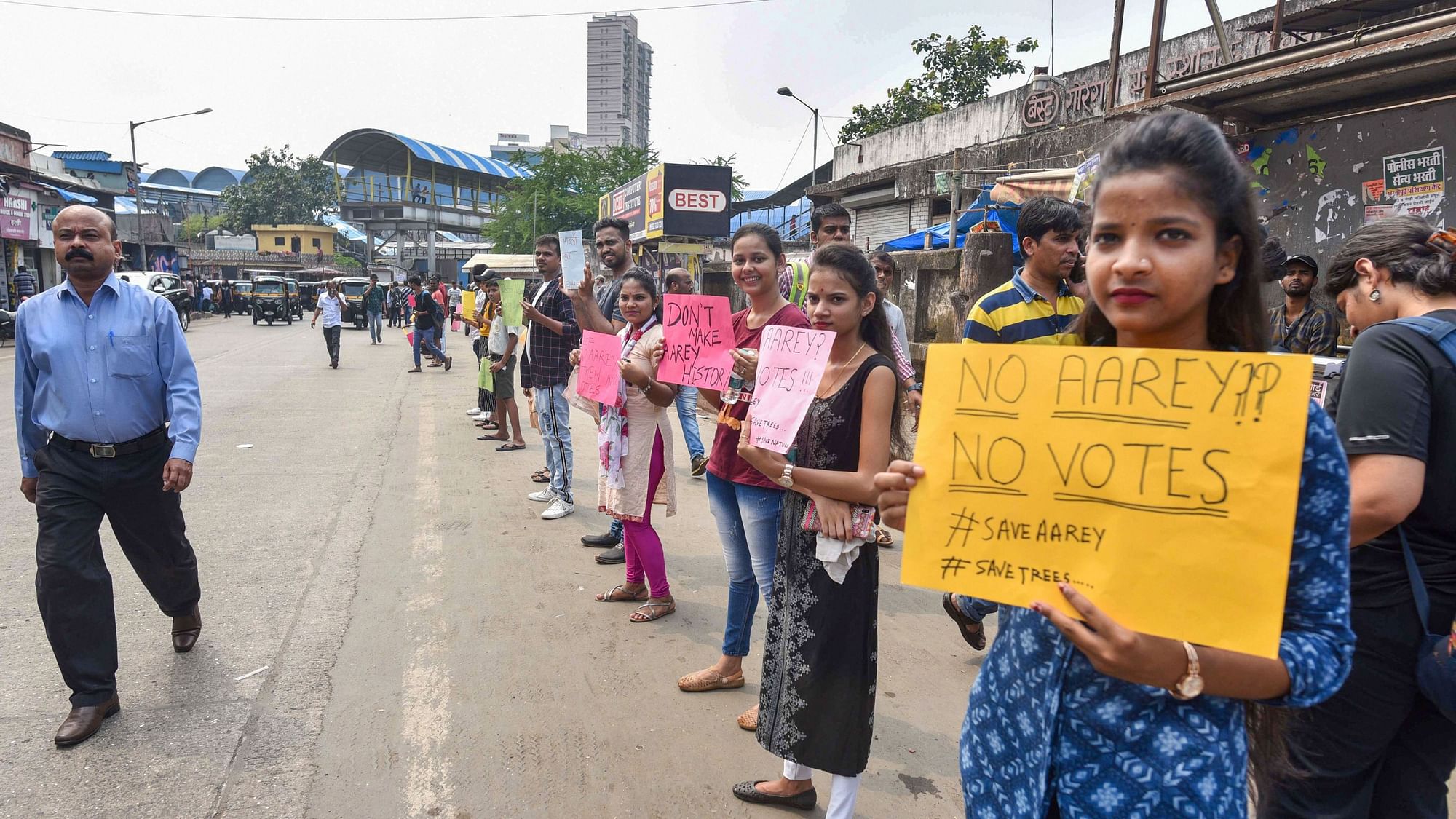  Activists and locals hold placards to protest the cutting of trees in Aarey Colony for the proposed car shed for Mumbai Metro 3, in Goregaon in Mumbai.