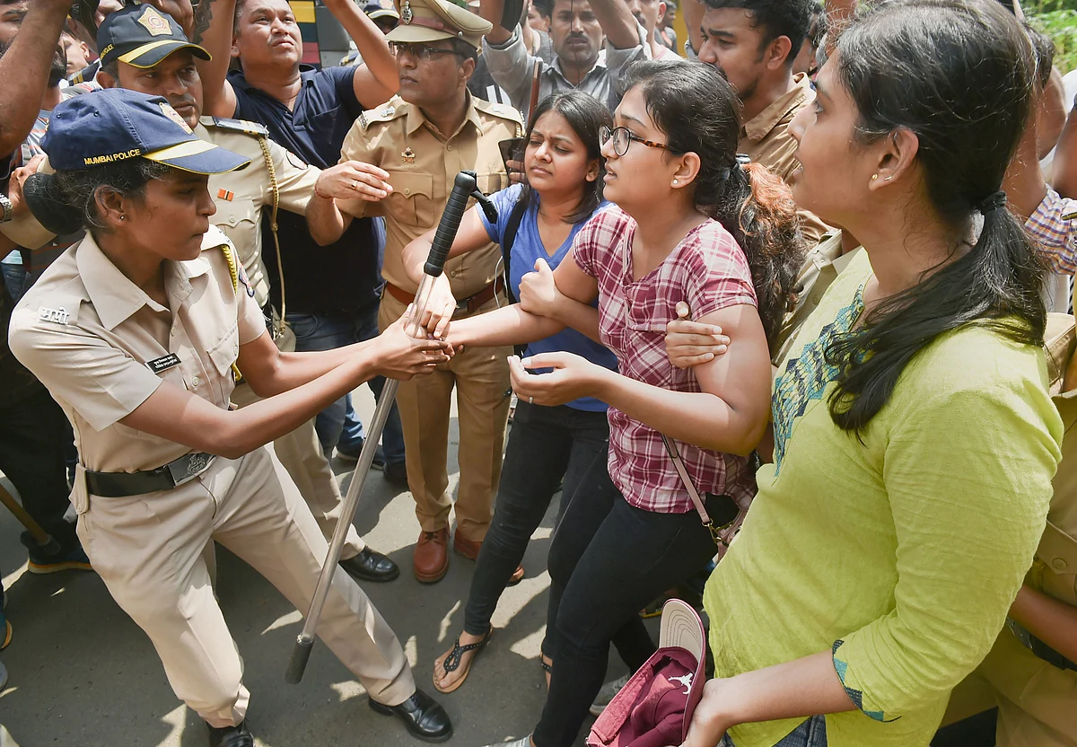 Police detain citizens who were staging a protest against the tree-cutting at Aarey.