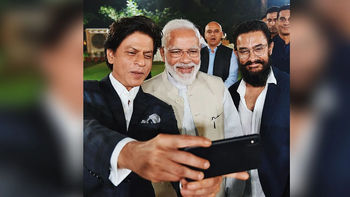 Shah Rukh Khan takes a selfie with PM Narendra Modi and Aamir Khan. 